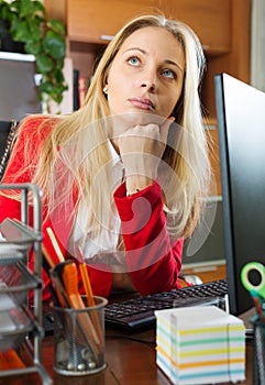 Businesswoman in red having a tedious time photo
