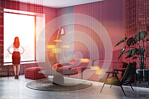 Businesswoman in red living room interior