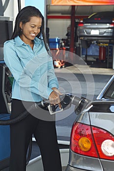 Businesswoman Refueling Car