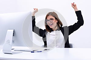 Businesswoman rejoicing at her success cheering