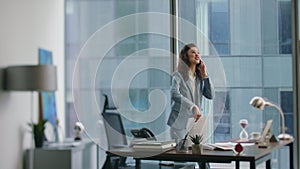 Businesswoman rejoicing victory calling at office. Happy woman throwing papers