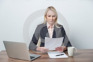 Businesswoman is reviewing legal documents.