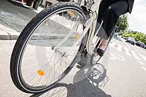 Businesswoman Riding Bicycle On Street