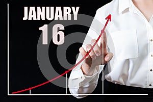 Businesswoman's hand pointing to the graph and a calendar with the date of 16 january. Business goals for the day.