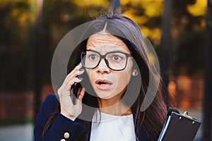 Businesswoman screaming on mobile phone. Having nervous breakdown at work, screaming in anger, stress management, mental