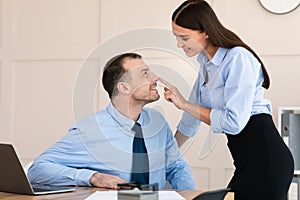 Businesswoman Seducing Male Employee Flirting At Workplace In Modern Office