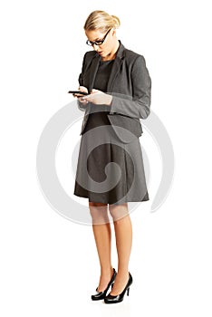 Businesswoman sending a message