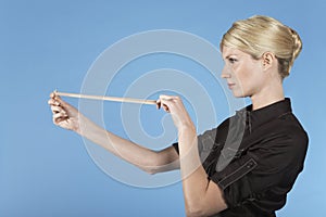 Businesswoman Shooting Rubber Band