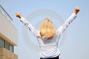 Businesswoman shouting her victory to the world