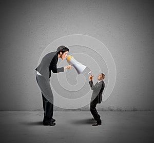 Businesswoman shouting through a megaphone