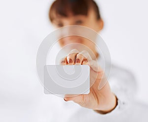 Businesswoman showing blank card