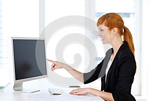 Businesswoman showing content on computer