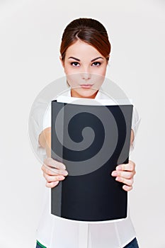 Businesswoman showing her report in black folder