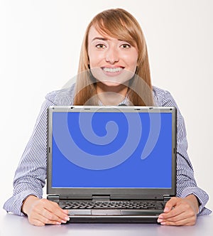 Businesswoman showing laptop with copyspace