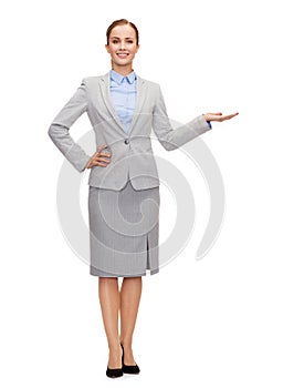 Businesswoman showing something on her hand