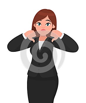 Businesswoman showing thumbs down gesture/sign. Dislike, disapprove, rejection, disagree concept . photo