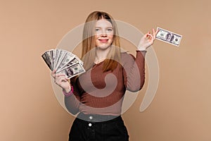 Businesswoman shows fan dollars