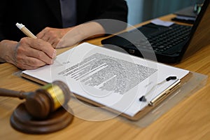 businesswoman sign contract. lawyer with document at law firm photo