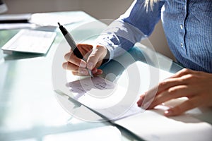 Businesswoman Signing Cheque photo