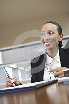 Businesswoman Signing Document