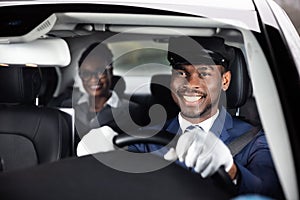 Close-up Of Happy Male Chauffeur Driving Car photo