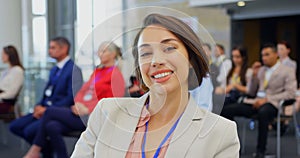 Businesswoman sitting in the business seminar and smiling 4k