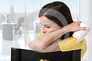 Businesswoman Sitting in a Chair Sleeping photo