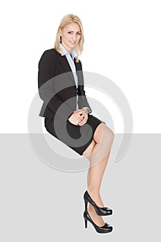 Businesswoman sitting on copyspace