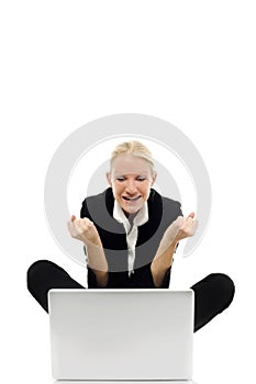 Businesswoman sitting on the floor with laptop