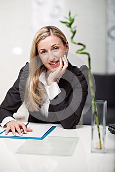 Businesswoman sitting at her desk