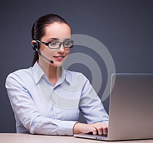 Businesswoman sitting at her desk in business concept