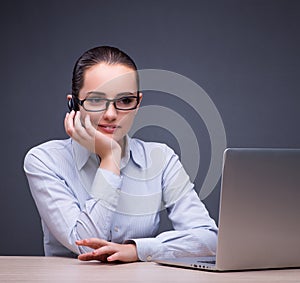 Businesswoman sitting at her desk in business concept