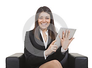 Businesswoman sitting looking tablet