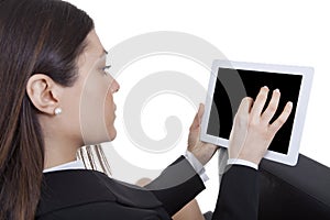 Businesswoman sitting looking tablet