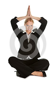 Businesswoman sitting in lotus flower position