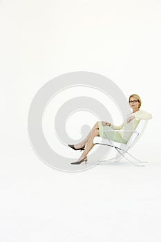 Businesswoman Sitting On Modern Chair