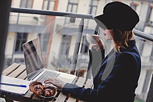 Businesswoman sitting near a table in breakfast time