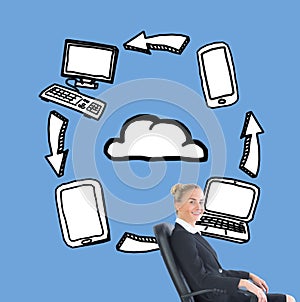 Businesswoman sitting in swivel chair in front of illustrations