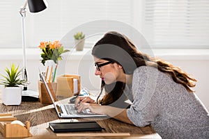 Businesswoman Sitting In Wrong Posture