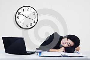 Businesswoman sleeping on her desk