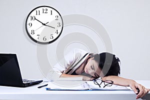 Businesswoman sleeping with laptop