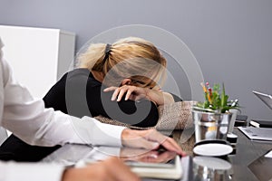 Businesswoman Sleeping While Sitting At Office