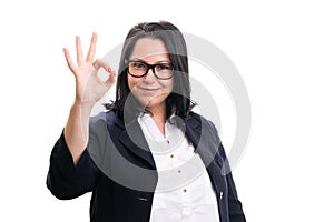 Businesswoman smiling as showing okay gesture wearing formalwear