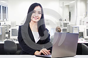 Businesswoman smiling in office