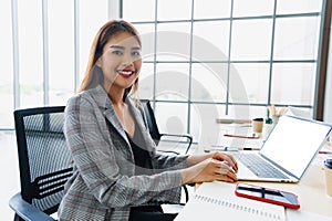 businesswoman smilling with using computer working