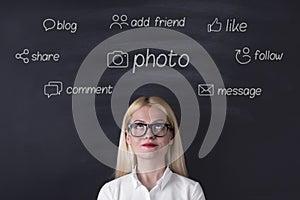 Businesswoman social media icons on the blackboard