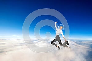 Businesswoman in spacesuit on the head flying in stratosphere.