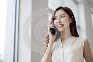 Businesswoman speak on smart phone