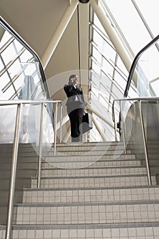 Businesswoman on Stairs - Wide Angle