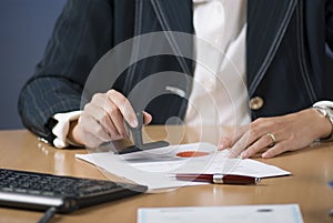 Businesswoman stamping document